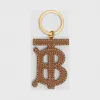 博百利/Burberry 女士 专属标识图案双色皮革钥匙吊饰 (黑色 / 棕色)  80181701